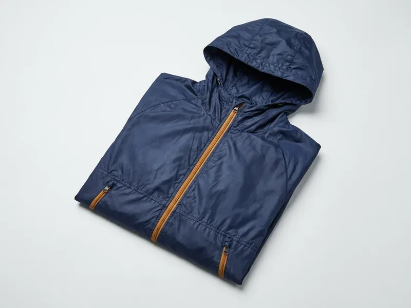 Blank fishing jacket, folded, no logo, no print, neutral background